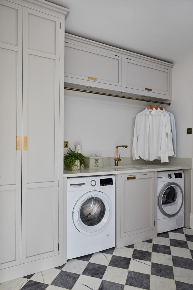 Inspiration for a coastal laundry room remodel in London
