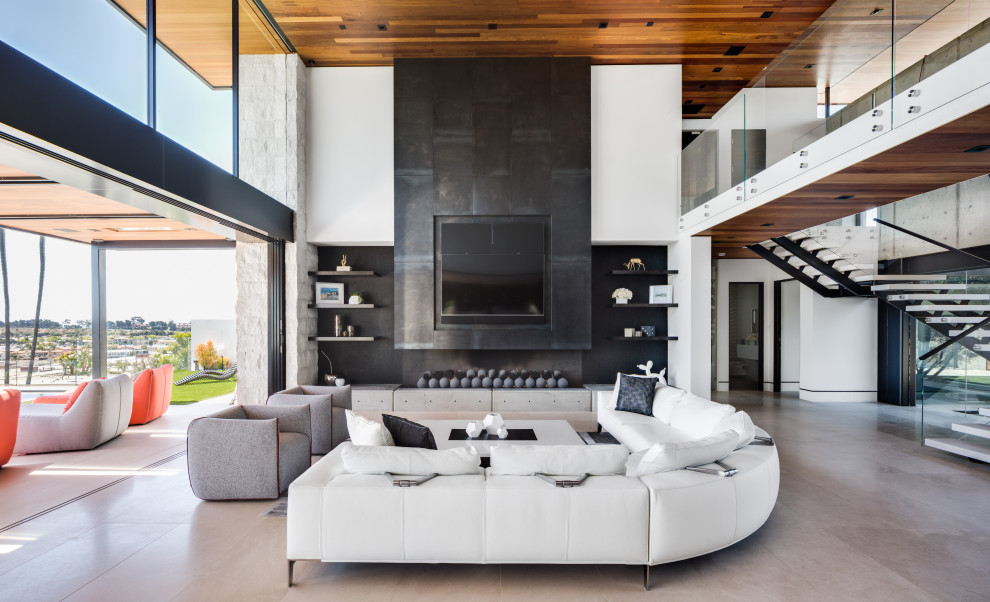 Inspiration for a contemporary open concept beige floor family room remodel in Orange County with white walls, a ribbon fireplace and a wall-mounted tv