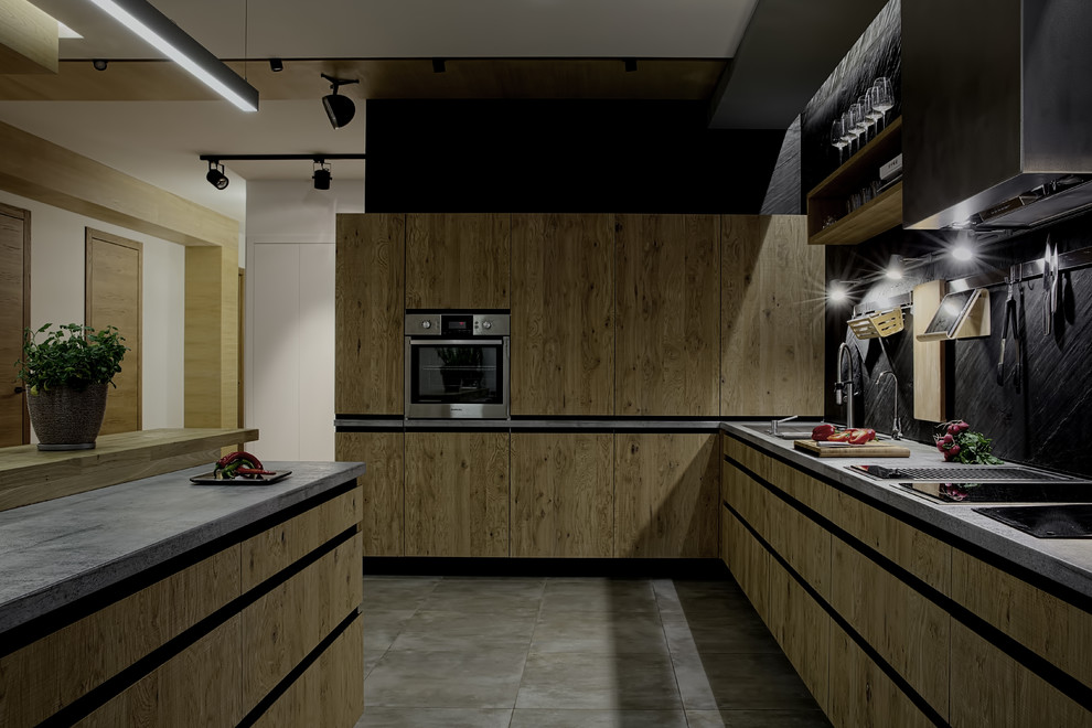 Inspiration for a l-shaped kitchen in Moscow with a double-bowl sink, flat-panel cabinets, medium wood cabinets, black splashback, stainless steel appliances, ceramic flooring, a breakfast bar and stone tiled splashback.