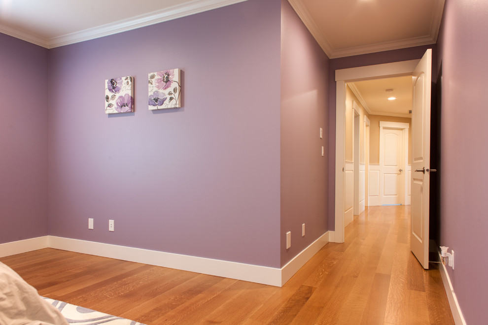Inspiration for a mid-sized traditional guest bedroom in Seattle with purple walls, medium hardwood floors and no fireplace.
