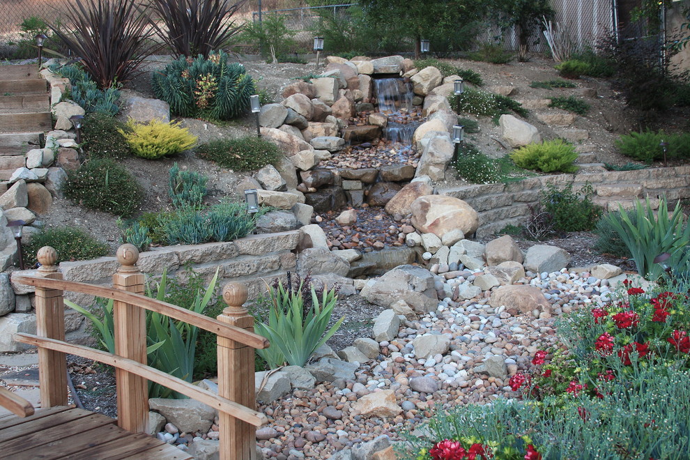 This is an example of a mid-sized mediterranean garden in Los Angeles.