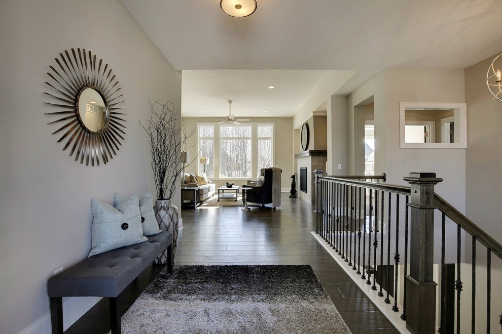 Inspiration for a mid-sized transitional dark wood floor foyer remodel in Minneapolis with gray walls
