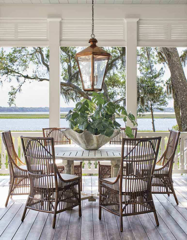 This is an example of a coastal porch design in Jacksonville with decking and a roof extension.