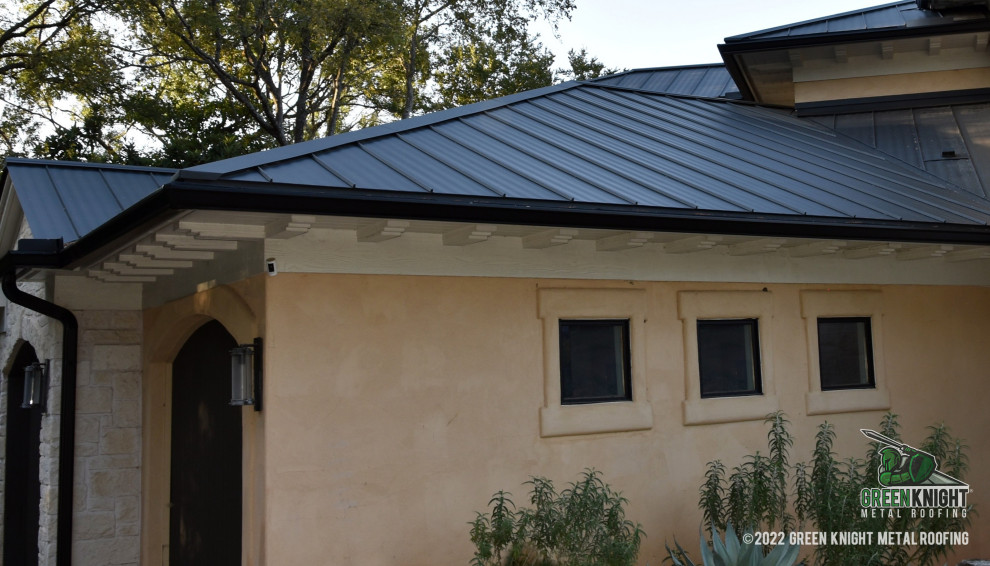 Design ideas for a classic house exterior in Austin with a metal roof and a black roof.