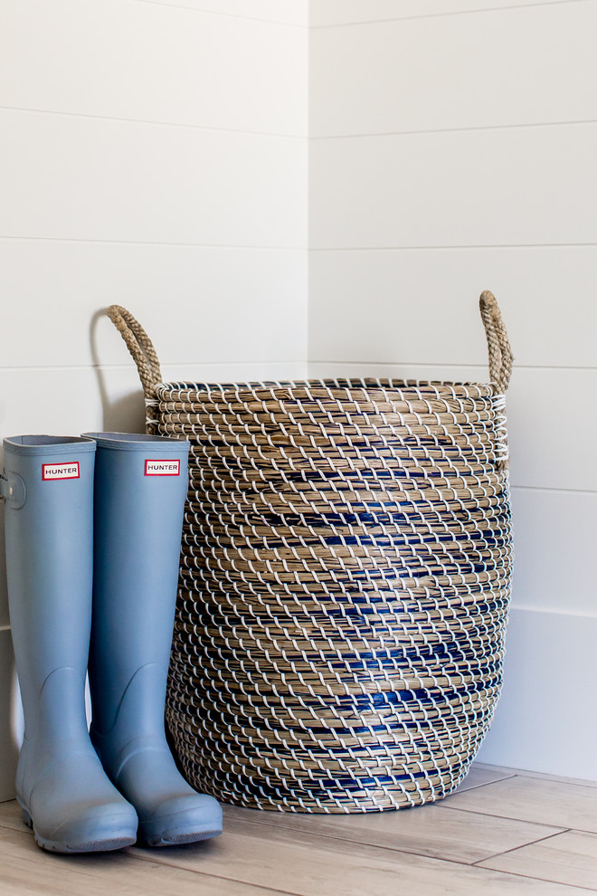 Inspiration for a large farmhouse porcelain tile entryway remodel in Salt Lake City with white walls and a white front door