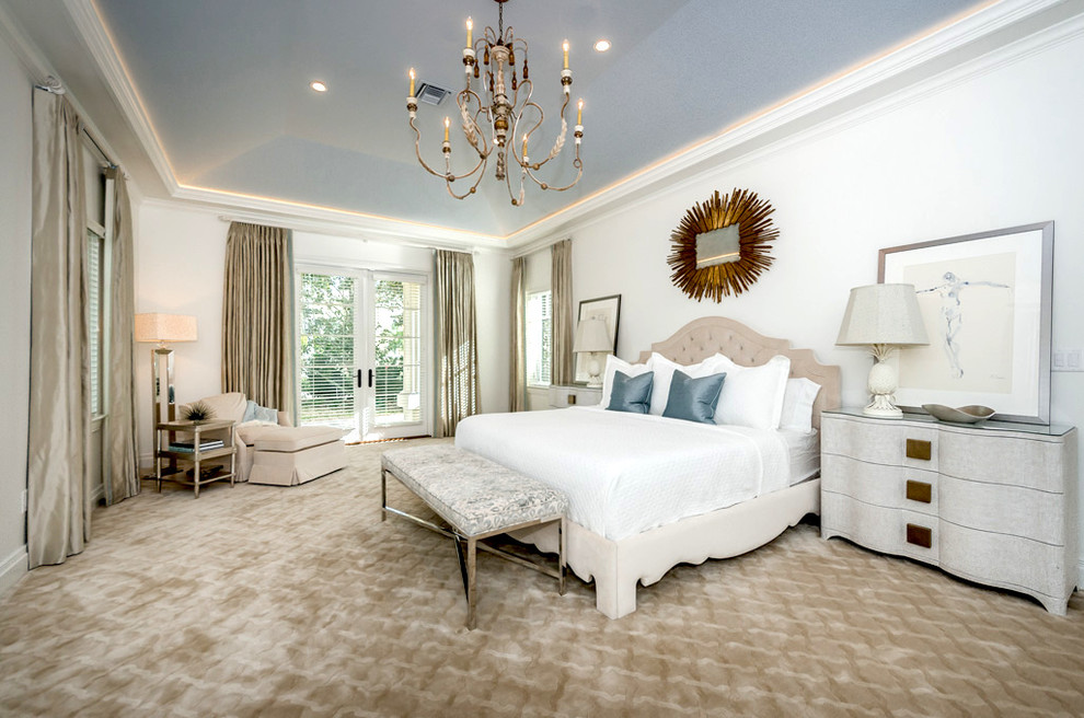 Mid-sized traditional master bedroom in Tampa with white walls, carpet, no fireplace and beige floor.