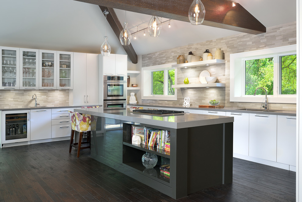 Design ideas for a large contemporary l-shaped eat-in kitchen in Toronto with an undermount sink, flat-panel cabinets, white cabinets, grey splashback, dark hardwood floors, with island, quartzite benchtops, ceramic splashback and stainless steel appliances.