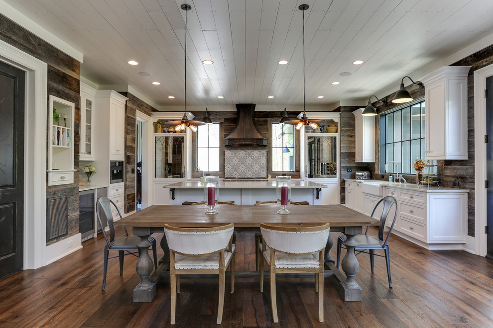 Photo of a large country kitchen/dining combo in Raleigh with brown floor and dark hardwood floors.