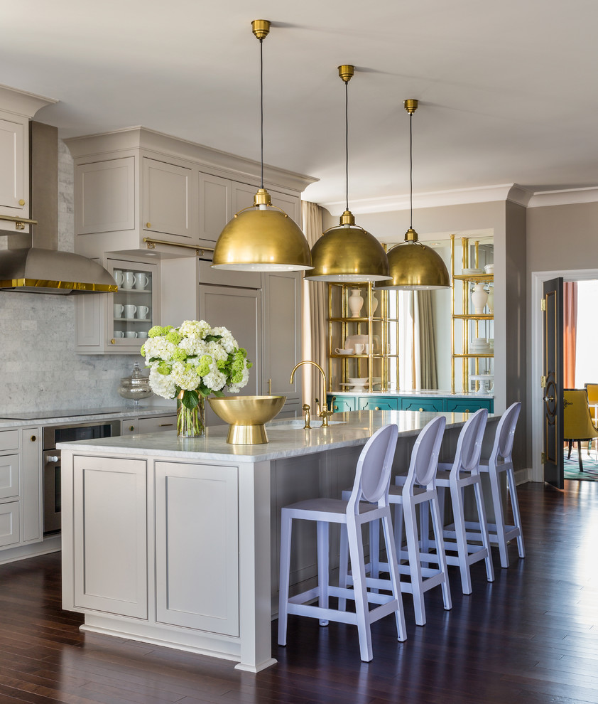 Example of a transitional kitchen design in Little Rock with white backsplash, stone tile backsplash, an island and beige cabinets