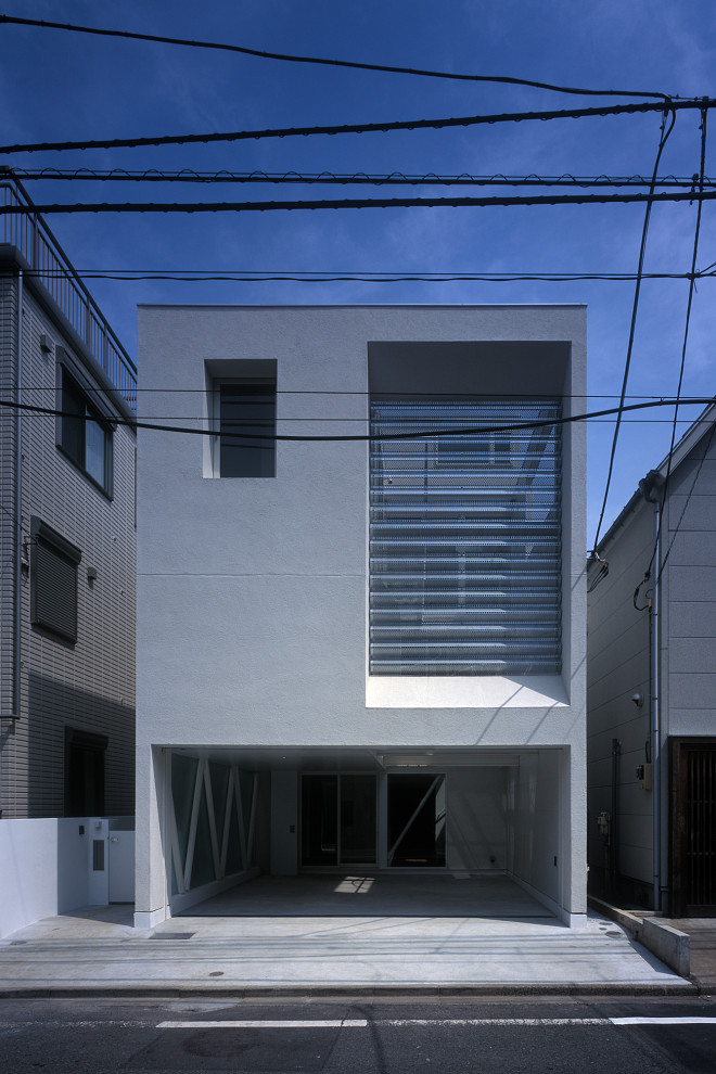 Idéer för mellanstora funkis vita hus, med tre eller fler plan, blandad fasad, pulpettak och tak i metall