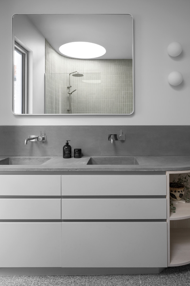 Photo of a large contemporary master bathroom in Melbourne with grey cabinets, an open shower, terrazzo floors, an integrated sink, concrete benchtops, an open shower and grey benchtops.