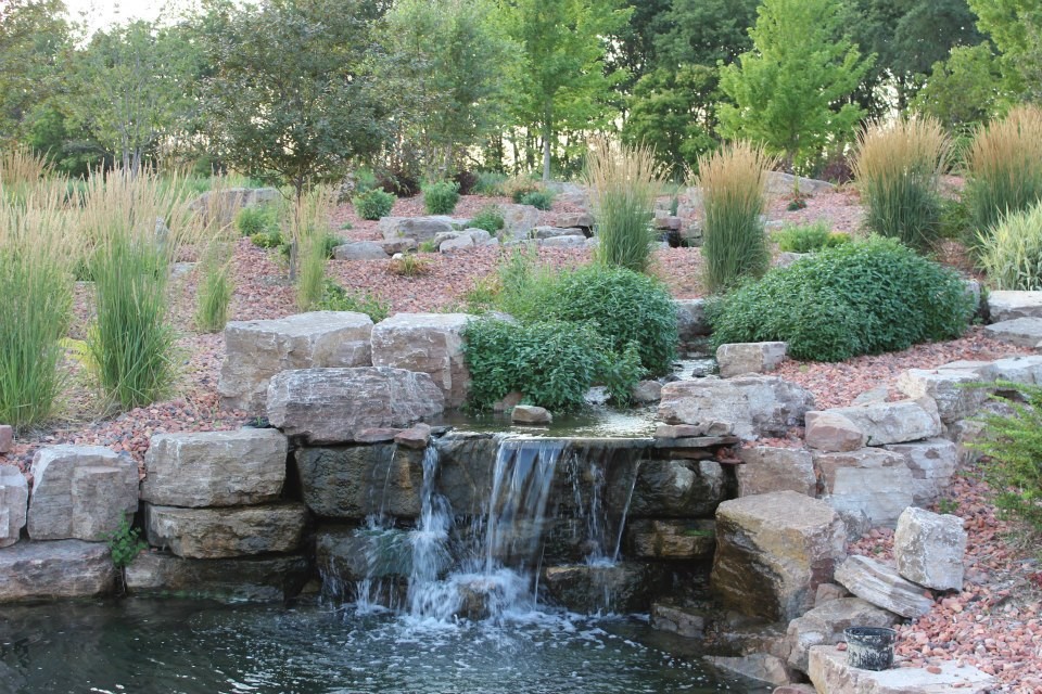 Photo of a traditional full sun backyard stone formal garden.