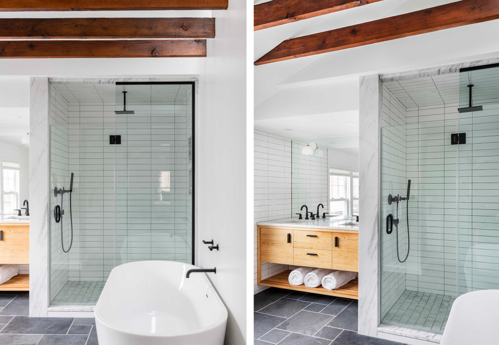 Inspiration for a mid-sized contemporary master white tile and ceramic tile porcelain tile, gray floor, double-sink and exposed beam bathroom remodel in Boston with flat-panel cabinets, light wood cabinets, a one-piece toilet, white walls, an undermount sink, marble countertops, white countertops and a built-in vanity