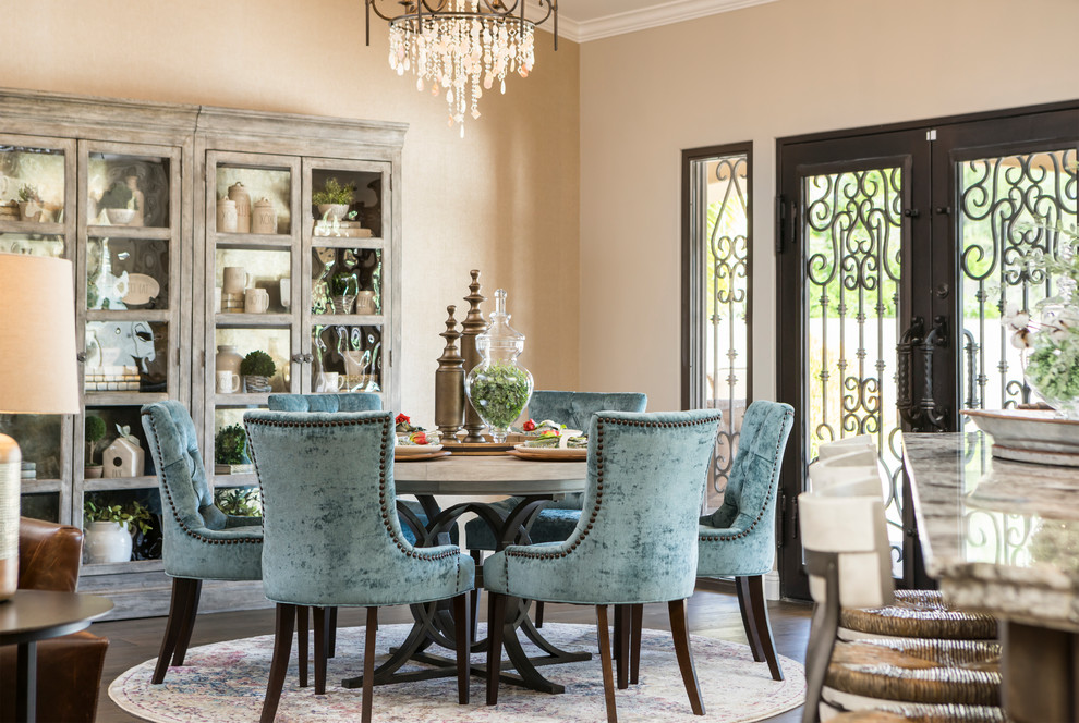 Example of a large transitional medium tone wood floor and brown floor kitchen/dining room combo design in Phoenix with metallic walls and no fireplace