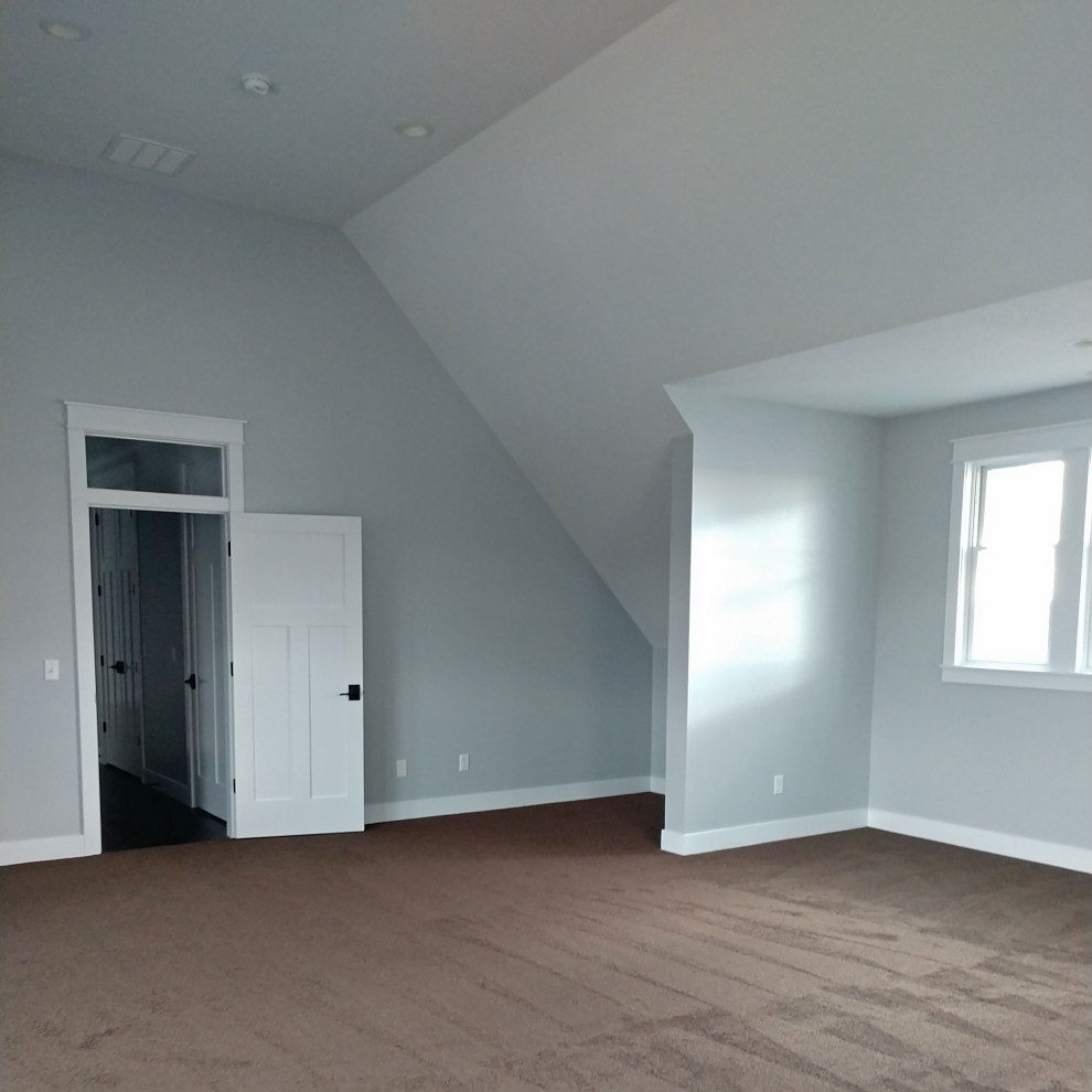 Photo of an arts and crafts enclosed family room in Other with grey walls, carpet, no fireplace, no tv and brown floor.