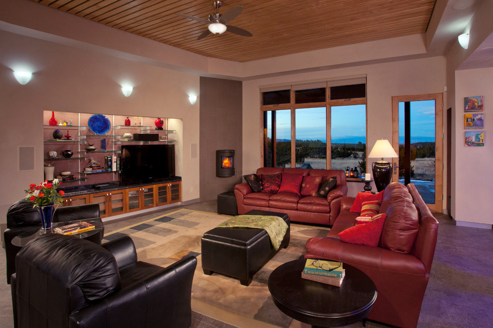 Design ideas for a contemporary living room in Albuquerque with ceramic floors, a wood stove, a tile fireplace surround and a built-in media wall.