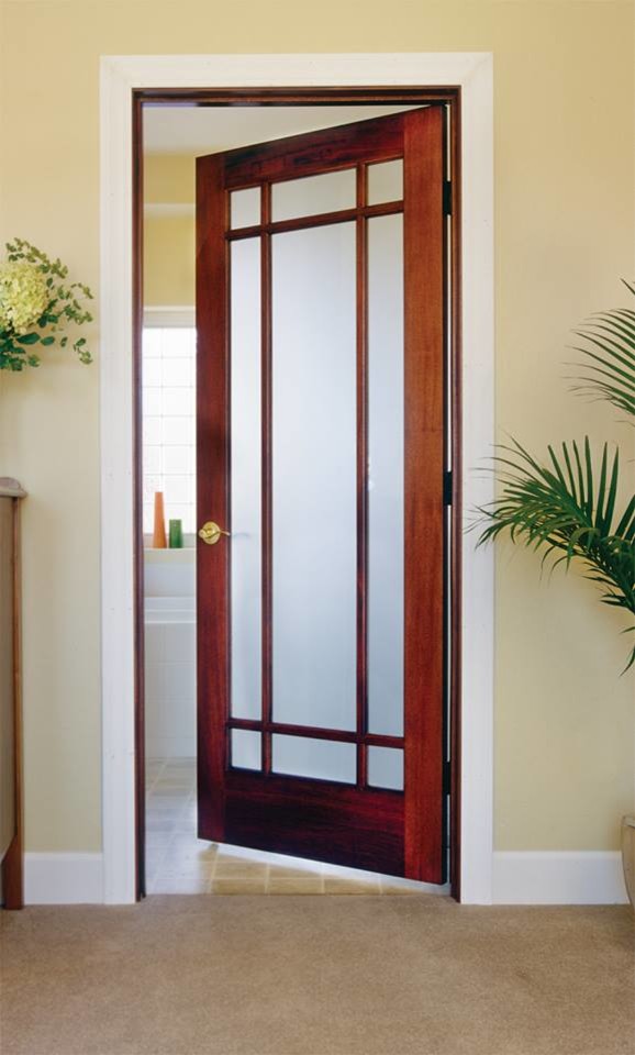 Small tropical hallway in Other with beige walls, concrete floors and brown floor.