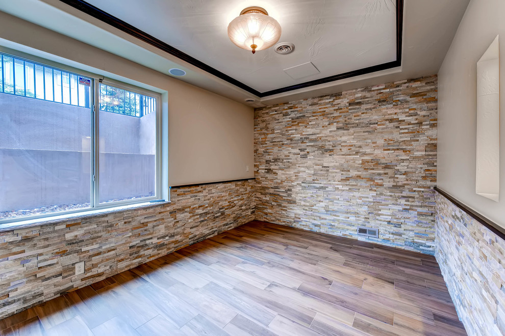 Mid-sized trendy walk-out ceramic tile and beige floor basement photo in Denver with beige walls and no fireplace