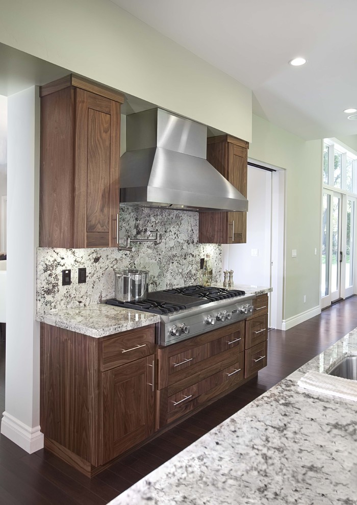 Design ideas for a contemporary kitchen in San Francisco with multi-coloured splashback, stone slab splashback, stainless steel appliances and dark hardwood floors.