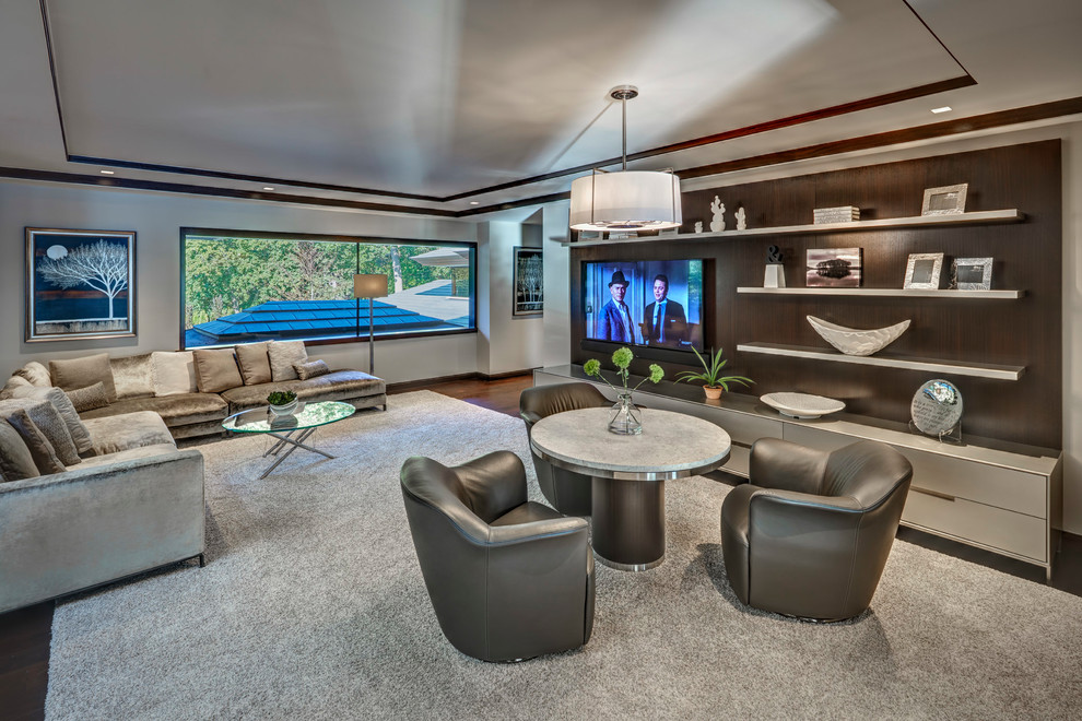 Contemporary living room in Detroit with a wall-mounted tv.