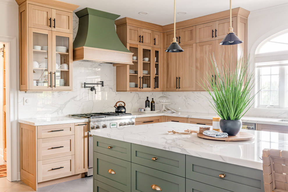 Example of a mid-sized farmhouse u-shaped ceramic tile and gray floor eat-in kitchen design in Philadelphia with an undermount sink, recessed-panel cabinets, light wood cabinets, marble countertops, white backsplash, marble backsplash, stainless steel appliances, an island and white countertops