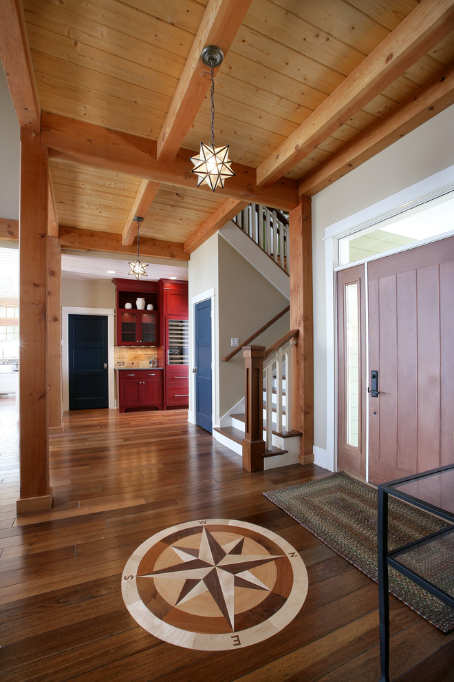 Traditional foyer in Grand Rapids with a single front door and a medium wood front door.