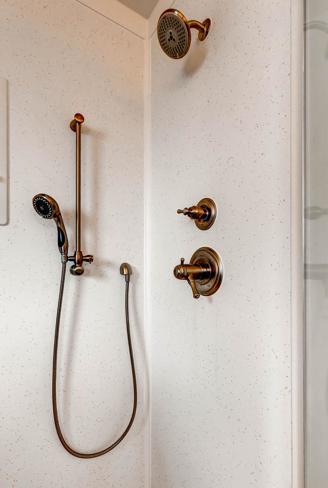 Small transitional master cement tile ceramic tile doorless shower photo in Denver with shaker cabinets, dark wood cabinets, a one-piece toilet, beige walls, an undermount sink and quartz countertops