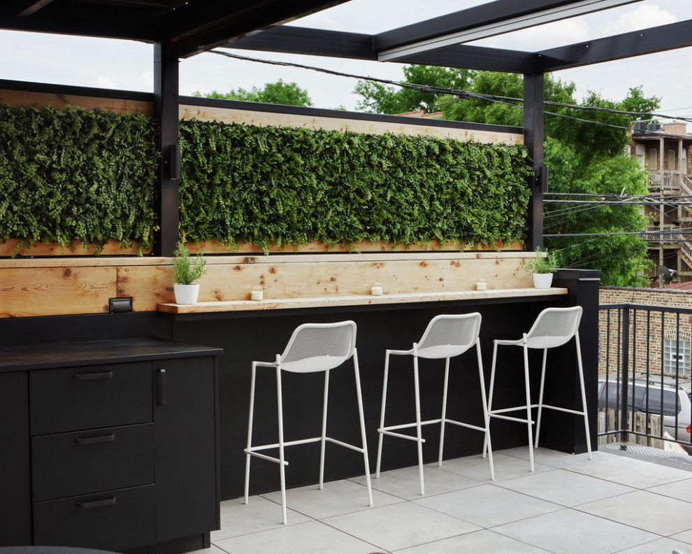 Small modern rooftop and rooftop deck in Chicago with an outdoor kitchen and a pergola.