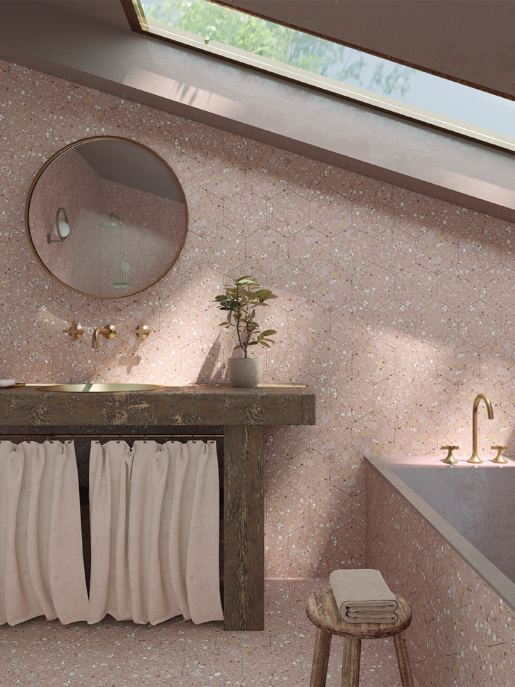 Photo of a modern bathroom in London with terrazzo benchtops.