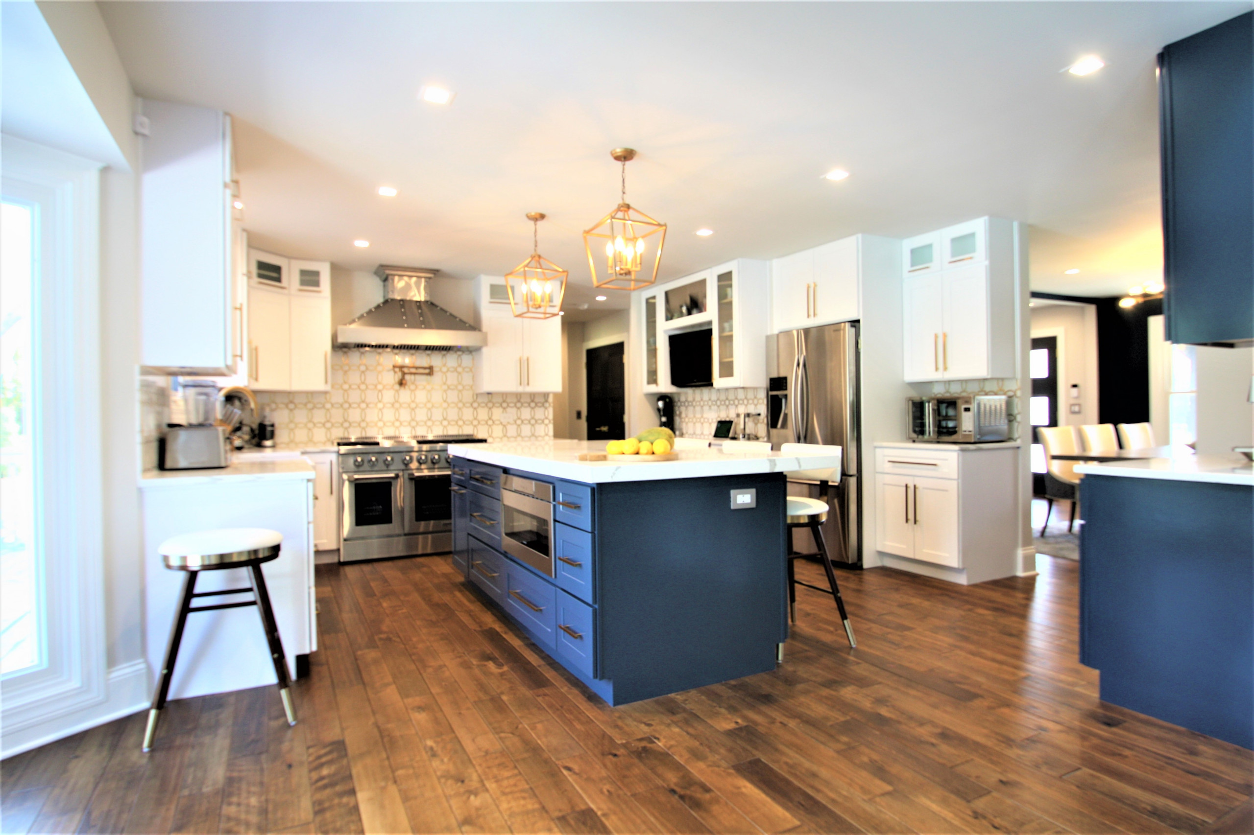 Modern kitchen design and remodel. Shaker style cabinets in white and blue.