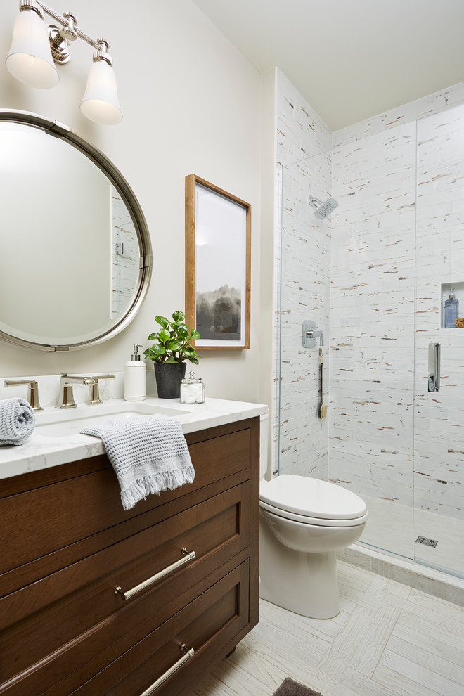 Mid-sized transitional 3/4 porcelain tile and multicolored tile porcelain tile and beige floor alcove shower photo in Minneapolis with a two-piece toilet, beige walls, an undermount sink, quartz countertops, a hinged shower door, white countertops, dark wood cabinets and shaker cabinets