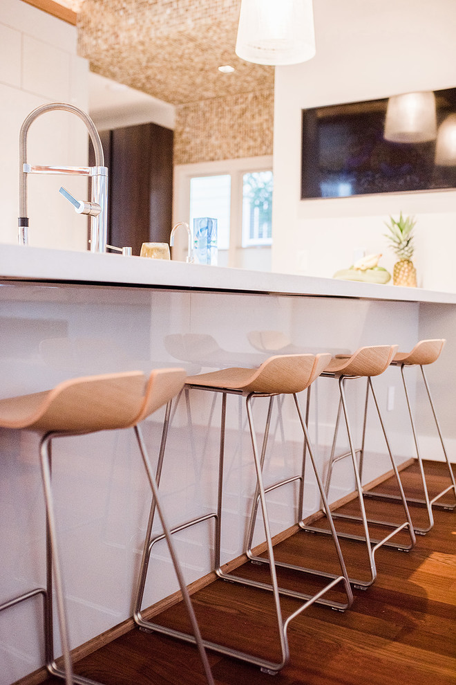 This is an example of a contemporary kitchen in Raleigh.