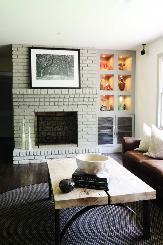 Contemporary living room in Atlanta with a standard fireplace and a brick fireplace surround.