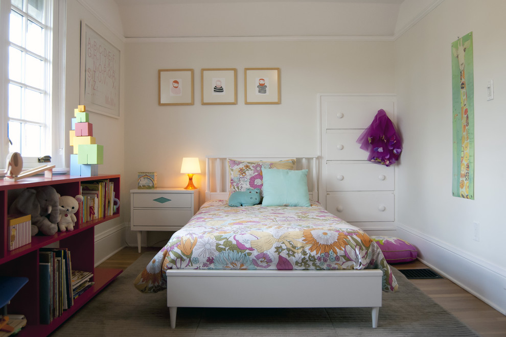 Inspiration for a mid-sized contemporary kids' bedroom for kids 4-10 years old and girls in Portland with white walls and light hardwood floors.