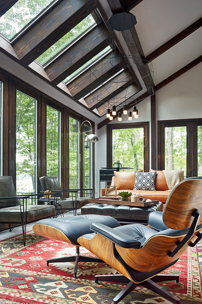 Photo of a large modern sunroom in Richmond with porcelain floors and a skylight.