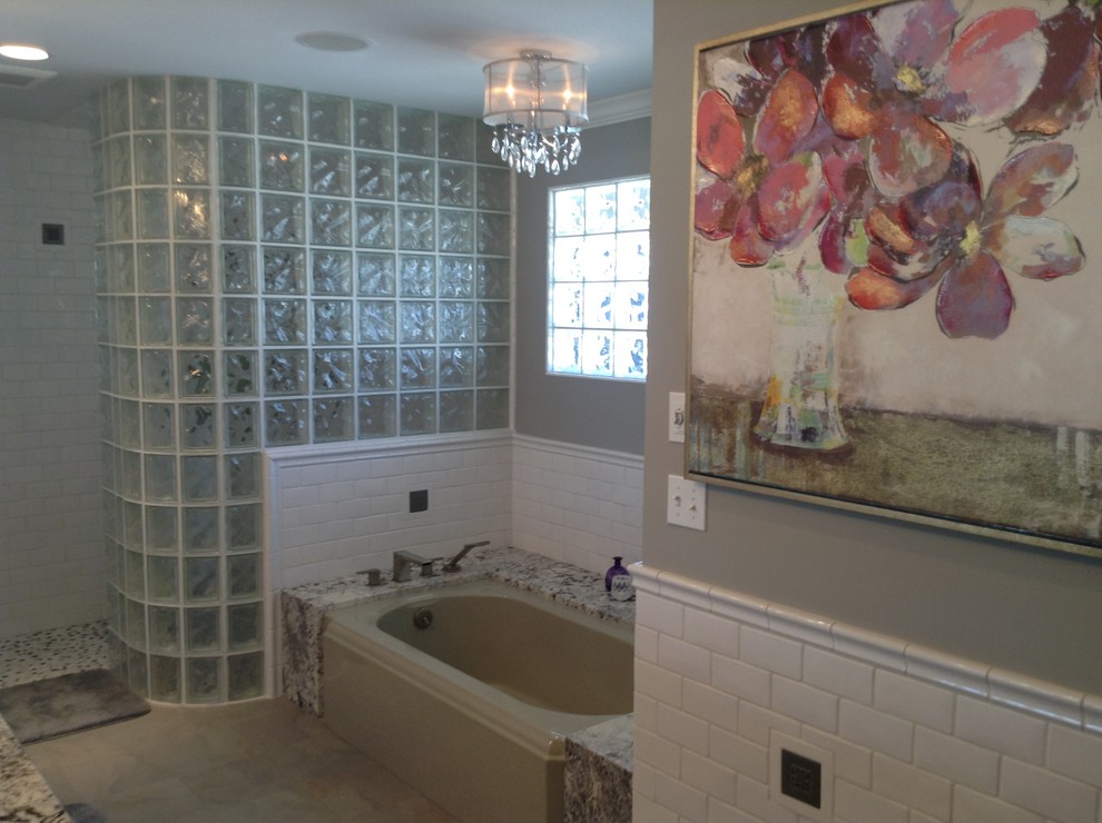 Example of a mid-sized transitional master white tile and subway tile porcelain tile walk-in shower design in Seattle with light wood cabinets, granite countertops, an undermount tub and gray walls