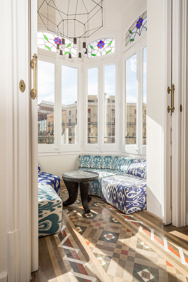 Small eclectic sunroom in Barcelona with ceramic floors, no fireplace and multi-coloured floor.