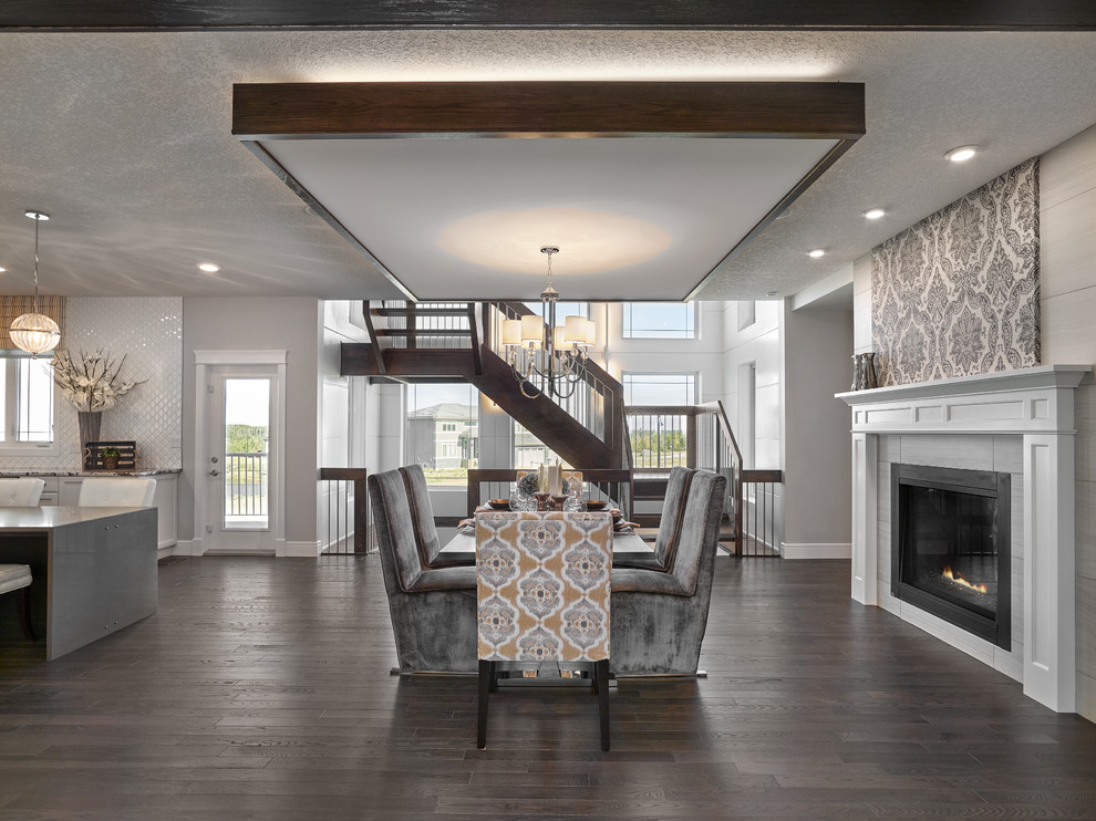 Example of a large transitional dark wood floor great room design in Edmonton with gray walls, a tile fireplace and a two-sided fireplace