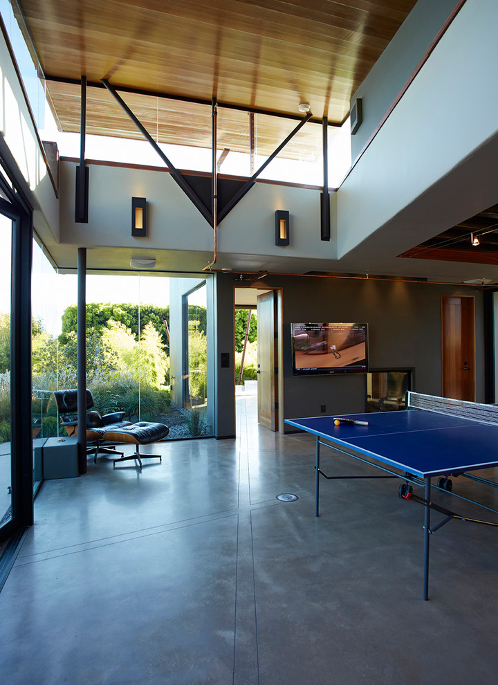 Photo of a contemporary family room in San Luis Obispo with concrete floors.