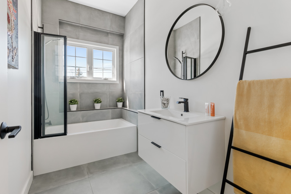 Mid-sized contemporary master bathroom in Montreal with flat-panel cabinets, white cabinets, an alcove tub, a shower/bathtub combo, gray tile, a single vanity, a floating vanity, white walls, ceramic floors, an integrated sink, grey floor, an open shower and white benchtops.