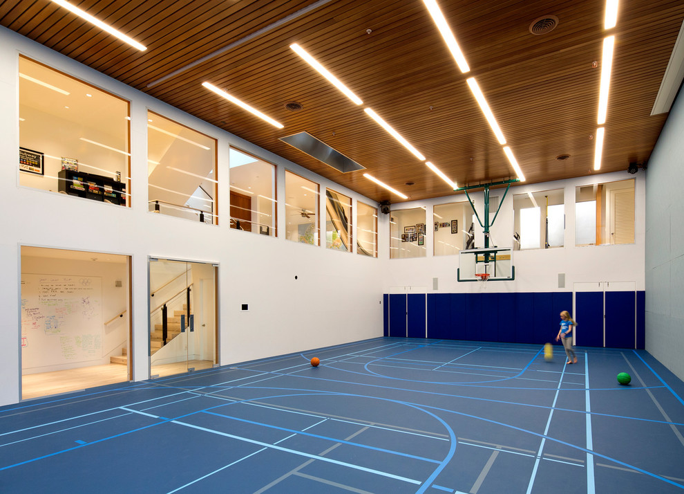 Expansive contemporary indoor sport court in San Francisco with white walls.