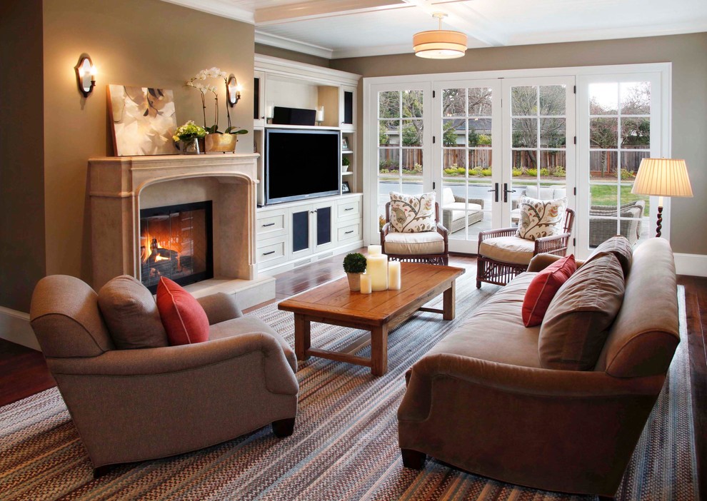 Inspiration for a traditional living room in San Francisco with a standard fireplace and a built-in media wall.