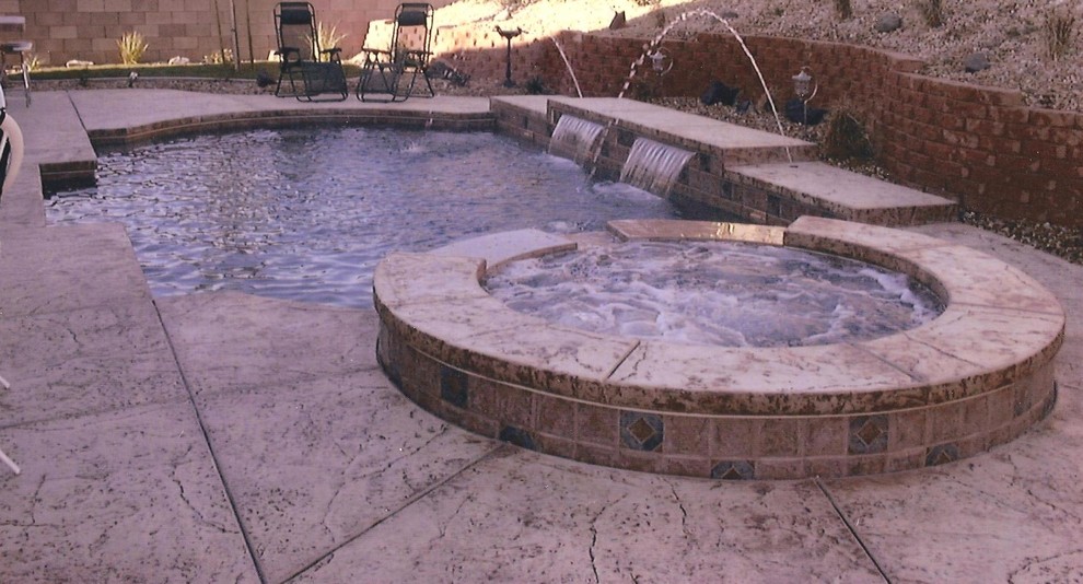 Inspiration for a large mediterranean backyard rectangular natural pool in Dallas with a water feature and stamped concrete.