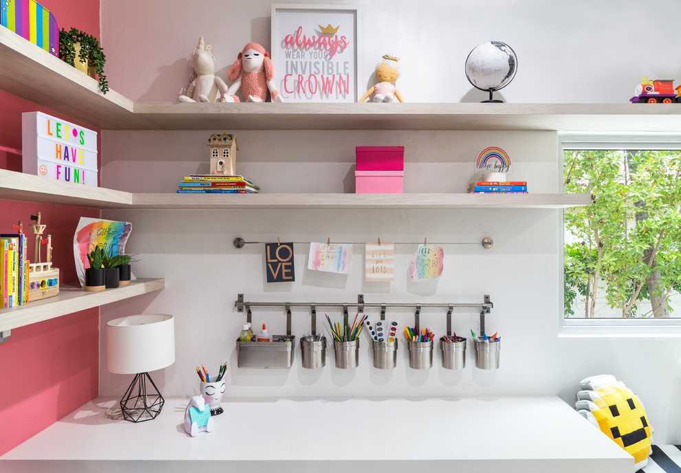Photo of a large contemporary gender-neutral kids' playroom for kids 4-10 years old in Miami with white walls, porcelain floors and grey floor.