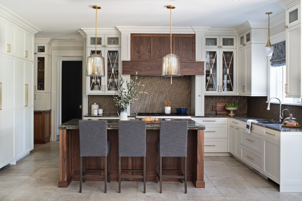 Expansive transitional l-shaped eat-in kitchen in Chicago with a single-bowl sink, white cabinets, quartzite benchtops, metallic splashback, mosaic tile splashback, panelled appliances, porcelain floors, with island, grey floor, green benchtop and recessed-panel cabinets.