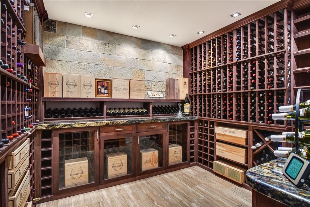 Design ideas for a contemporary wine cellar in San Diego with storage racks and beige floor.