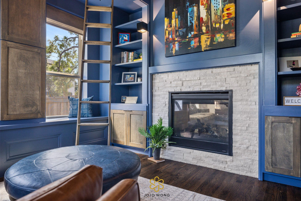 Design ideas for a transitional living room in Houston with blue walls, a standard fireplace, a brick fireplace surround and brown floor.