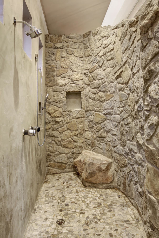 Photo of a large transitional master wet room bathroom in Austin with pebble tile floors, gray tile, stone slab, grey floor and an open shower.
