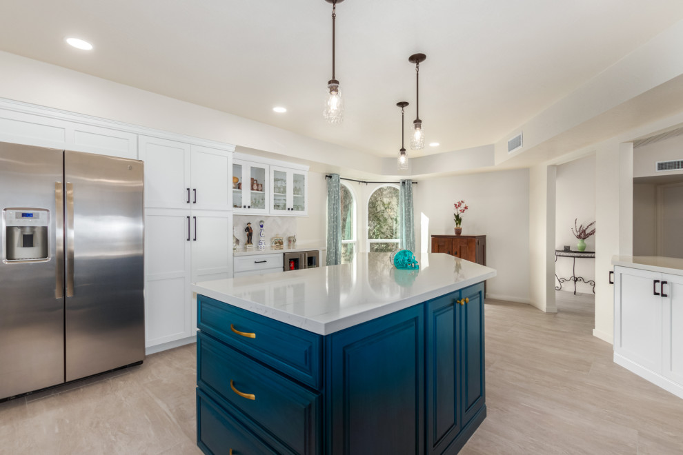 Transitional gray floor kitchen photo in Phoenix with a farmhouse sink, shaker cabinets, white cabinets and subway tile backsplash