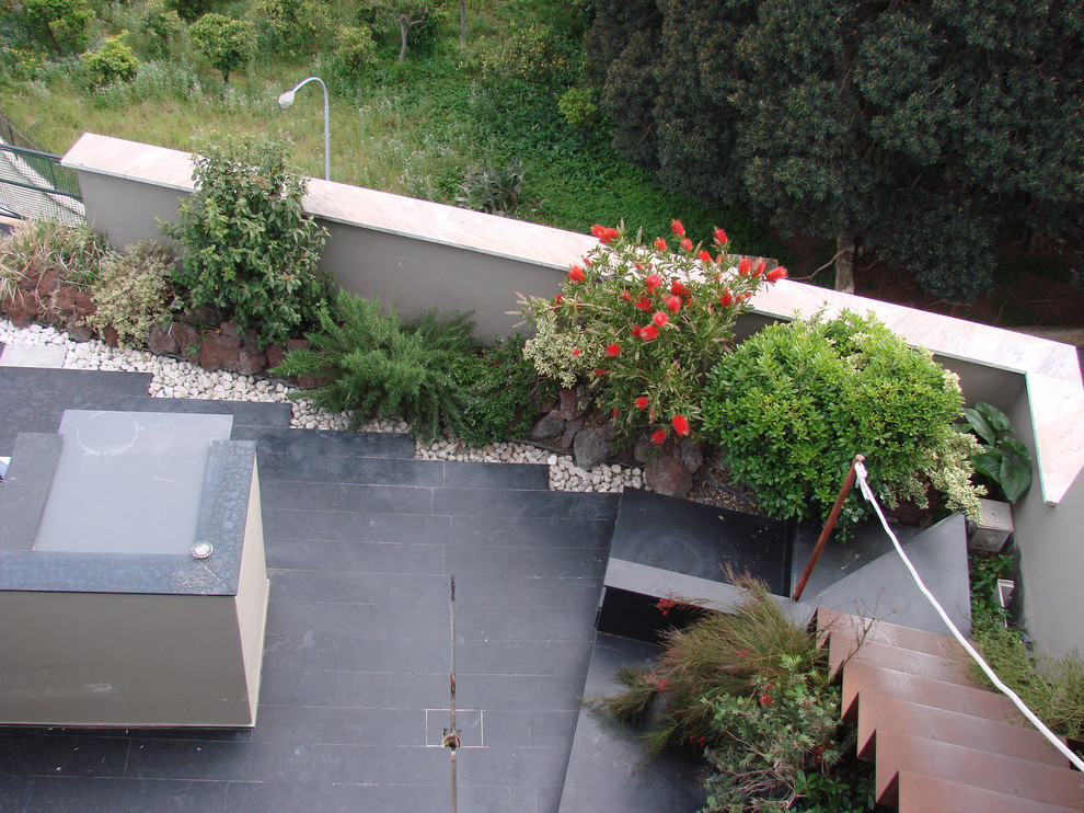 Inspiration for a mediterranean rooftop deck in Catania-Palermo with an outdoor kitchen.